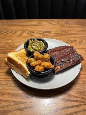 Three rib bones, green beans, fried okra and a side of Texas toast.