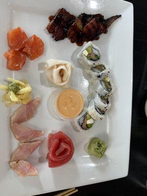 Sashimi platter and a roll.