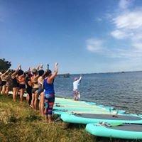 Stand up Paddle Yoga class at Sunset Park, Harvey Cedars.