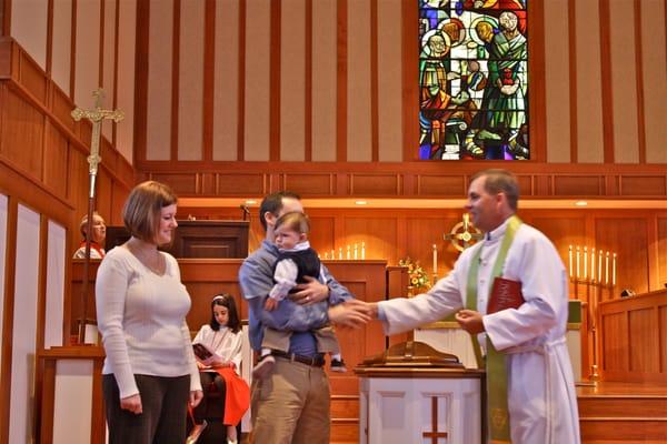 My first grandson is being baptized, pictures with mom and dad.