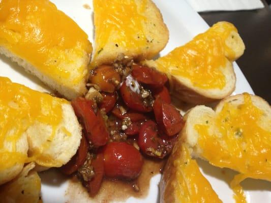 Cheese toast with tomatoes. Ok but not a fan of oregano.