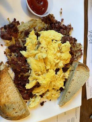 Corned beef hash over hash browns w eggs and rye toast.   Fabulous.