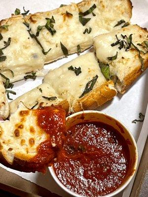 12" Garlic bread with cheese nice touch with basil on top came with marinara sauce