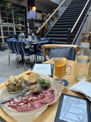 Atrium, hot toddy, meat and cheese plate