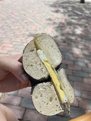 Egg and cheddar on a poppy bagel.