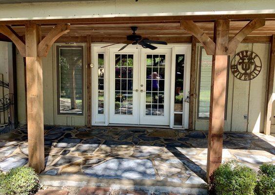 New Flagstone on poured cemented base.  New cedar posts with corbels.