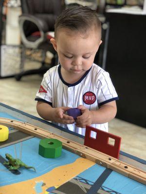 Playing after his haircut!