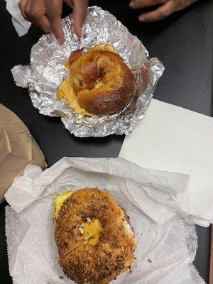 2 bagels sandwiches perfect for any morning. Bacon egg and cheese on a cranberry orange bagel.