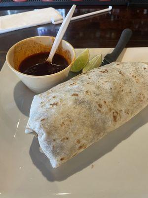 Large steak burrito with a side of Birria consommé for dipping. $7