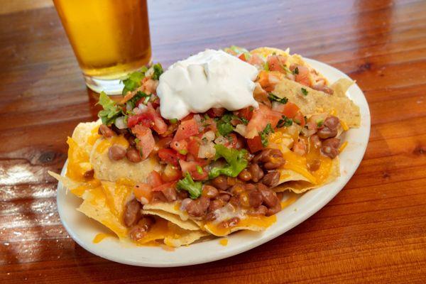 Nachos go great with sports on the HDTVs inside our Lisa's Cantina!