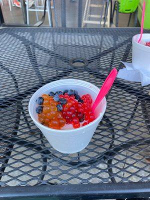 The frozen yogurt, along with the toppings