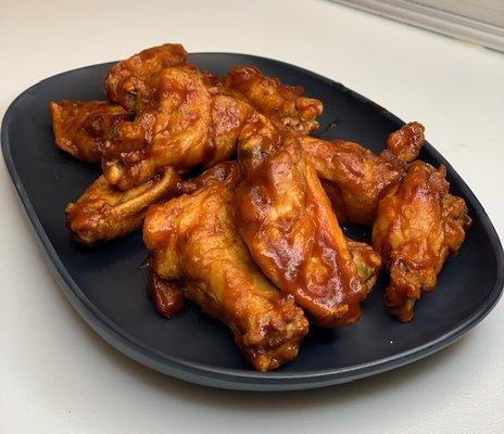 Bone-In Traditional Wings, pictured with BBQ Sauce