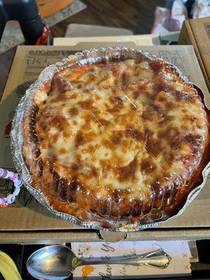 Spaghetti and meatballs. It is in a two inch deep dish. A lot of food for a hungry appetite