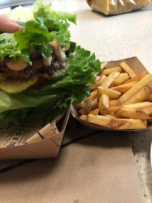 Lettuce wrapped double burger with cheddar, onion, tomato and chipotle mayo and fries