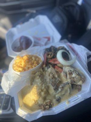 Baked chicken, dressing and gravy, collards, Mac and cheese and cranberry.