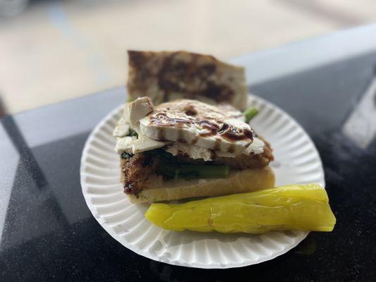 Veal Milanese sandwich w fresh mozzarella and balsamic and broccoli rabe. Pickled long hot stuffed w provolone on the side