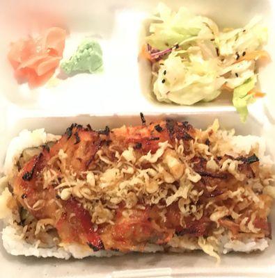 Daddy roll: shrimp tempura, cream cheese, cucumber and avocado inside. Topped w/ crab dynamite.