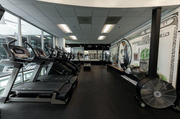 Cardio equipment including treadmills, stairmaster, assault runner / assault bike.