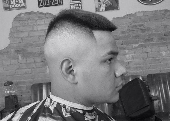 Marquhino executing a bald fade