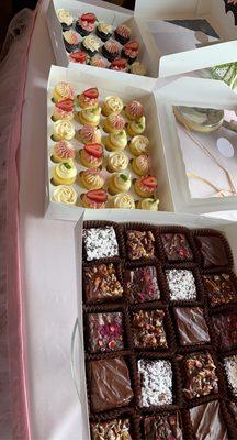 Boxed mini cupcakes and gourmet brownies.