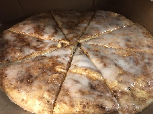 Dessert Pizza - soft-baked dough, buttered, topped with cinnamon/sugar, and covered in vanilla icing.