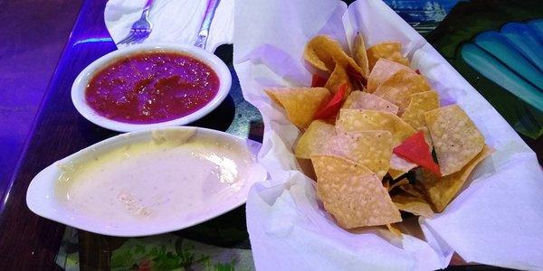 Salsa, queso dip and chips.