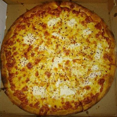 Large white pizza with ricotta.