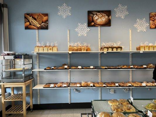 More fresh baked goods on shelves against the wall.