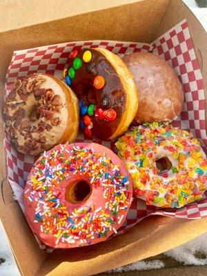 So many choices! Maple bacon, M&Ms, raspberry filled, strawberry sprinkle, Fruity Pebbles