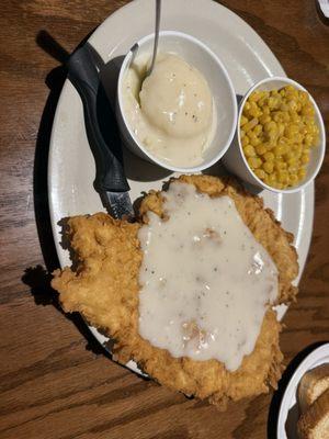 Chicken Fried Chicken with cream gravy, mashed potatoes, and corn