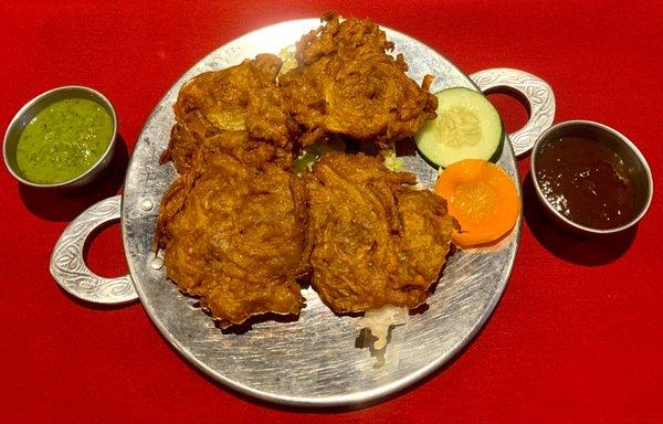 Onion Bhaji- Onion, potato, and spinach fritters fried in gram flour batter.