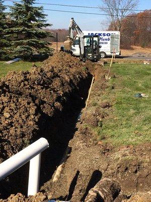 The Jackson Plumbing crew installing a sewer service in Waterford.