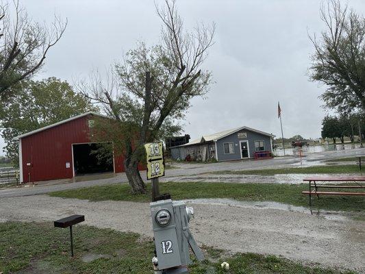 This is a photo of the clubhouse and the horse barn they have on site