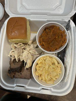 Combination plate brisket and chicken with Mac and Cheese and Sweet Potato Casserole, also with Tiger Sauce.