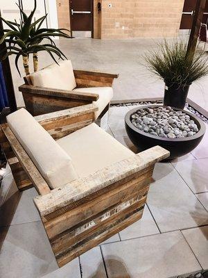 Fire bowl and reclaimed wood furniture provided by us for a landscape trade show booth.