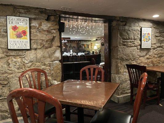 Basement dining room with full bar and fireplace.