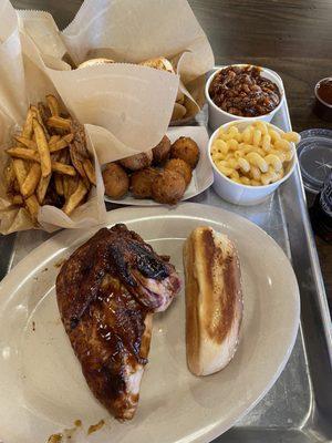 Smoked chicken breast, hand cut fries, hush puppies, baked beans and Mac and cheese.