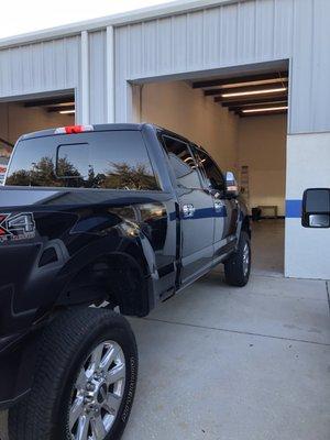 Ford F-250 Platinum show truck getting limo tint all around.