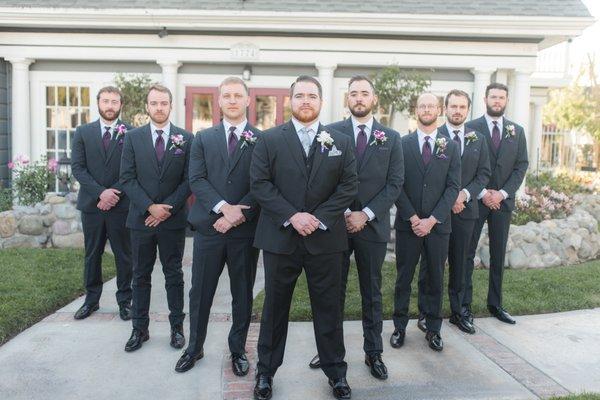 Groomsmen photo in front of the house.