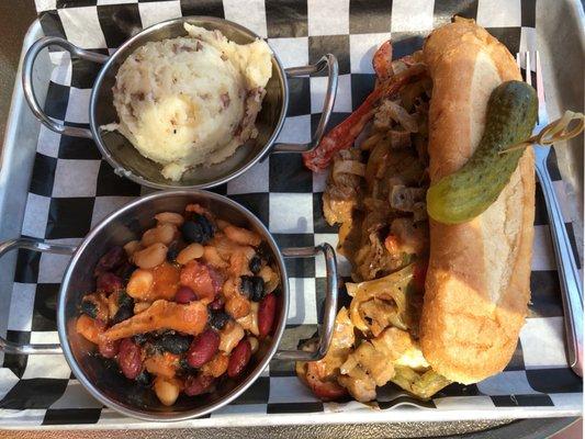 Burnt Ends Cheesesteak Sandwich with Garlic Mashed Potatoes and Baked Beans