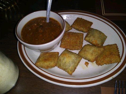 Fried ravs and brown sauce. Ravs over-cooked.