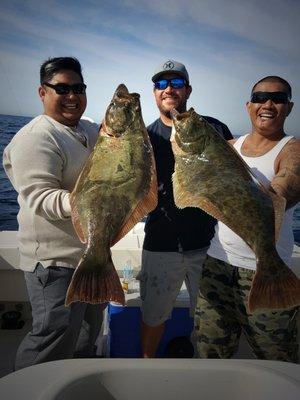 Happy clients with a pair of solid California Halibut with Captain Marc Levine