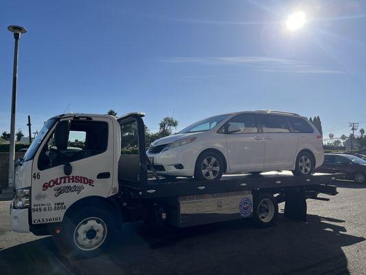 My van on the flatbed tow