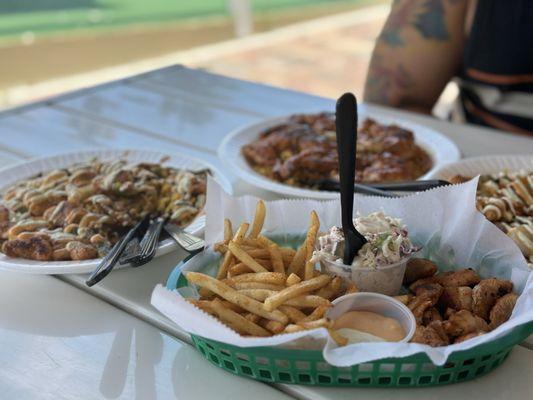 Gator Bites (front), stir fry (left), frog legs (back)