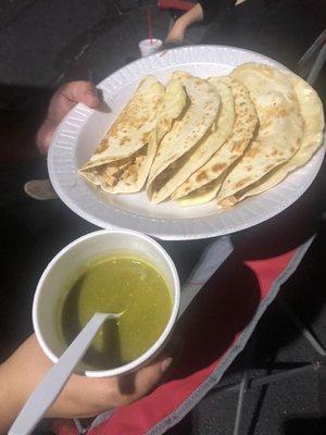 Quesadilla served with signature green salsa.