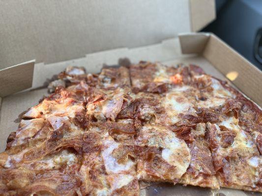 All meat pizza, thin crust .