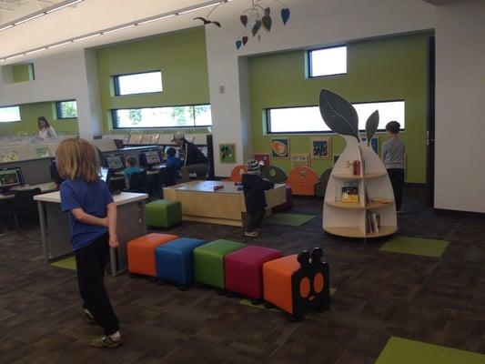 Kids area seating, activities, computers.