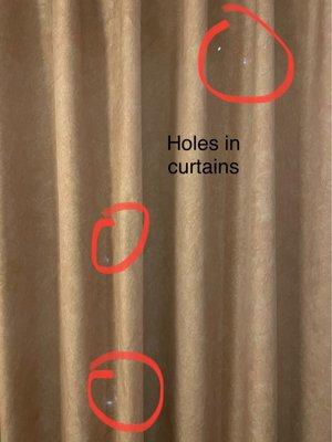 Holes in curtains.