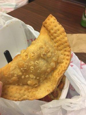 The best chicken empanada ever. So cheesy.. perfect. Must try