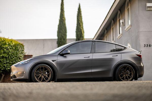 Model Y Standard Range lowering on coilovers with 20" wheels.  Full wrap and PPF.